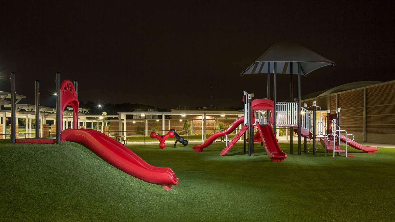 Nighttime artificial turf playground by Southwest Greens of Asheville